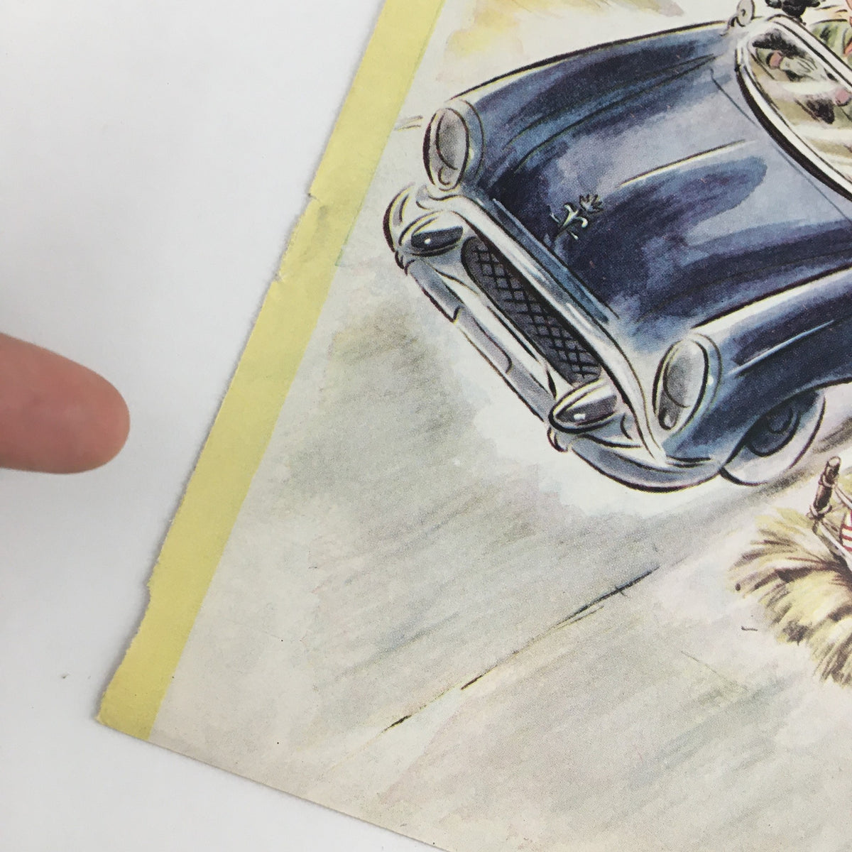 Close-up view of The New Yorker September 8 1956 cover corner, highlighting the vivid illustration of a blue car driving on a sandy path with bottles on a cart, artwork by Constantin Alajalov.