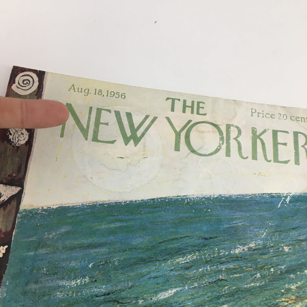 Detail of the date and title on the cover of The New Yorker, August 18, 1956, illustrated by Abe Birnbaum, highlighting the vintage charm and artistic design.