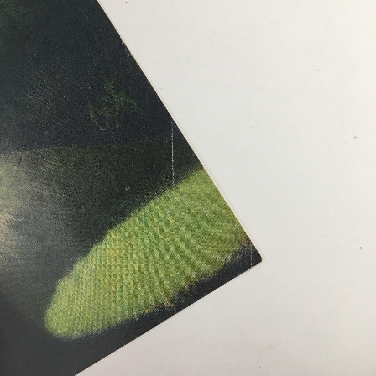 Close-up view of the edge of The New Yorker July 7, 1956 cover by Arthur Getz, showcasing minor wear and vintage details that enhance its authenticity as a collectible piece.