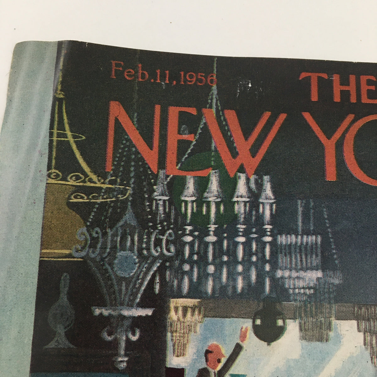 Detail of The New Yorker February 11, 1956 cover by Charles E. Martin, highlighting the title and decorative elements including chandeliers.