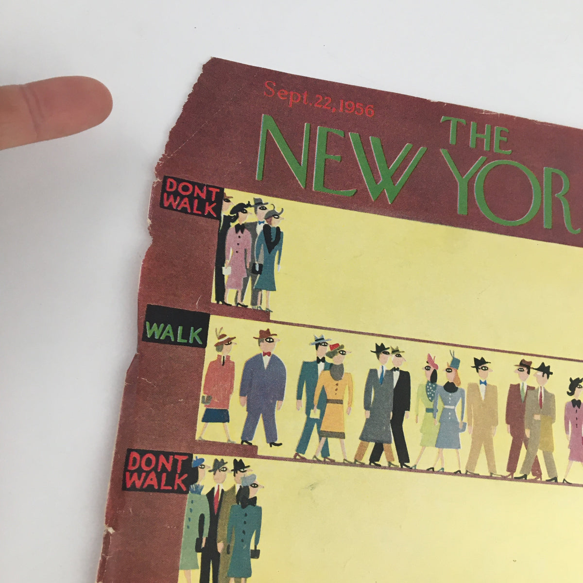 Close-up view of The New Yorker September 22, 1956 cover featuring vibrant art by Charles E. Martin, highlighting the 'Don't Walk' and 'Walk' indicators among chic 1950s characters.