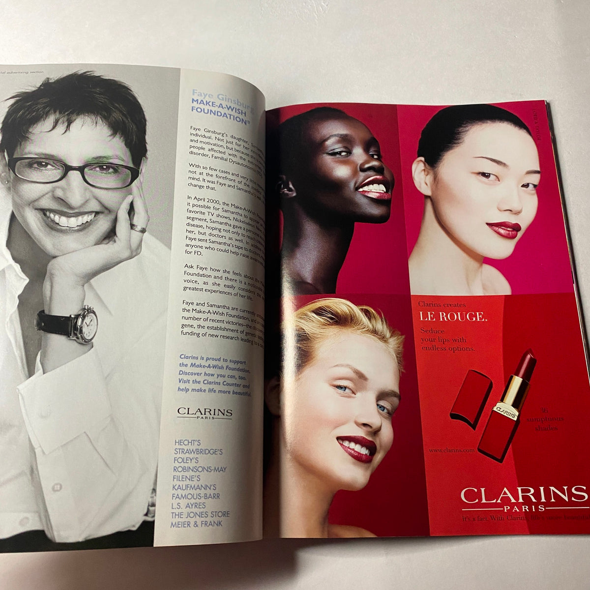 Advertisement from Vogue Magazine January 2002 for Clarins, showcasing beauty products alongside diverse models, maintaining the magazine’s sophisticated aesthetic.