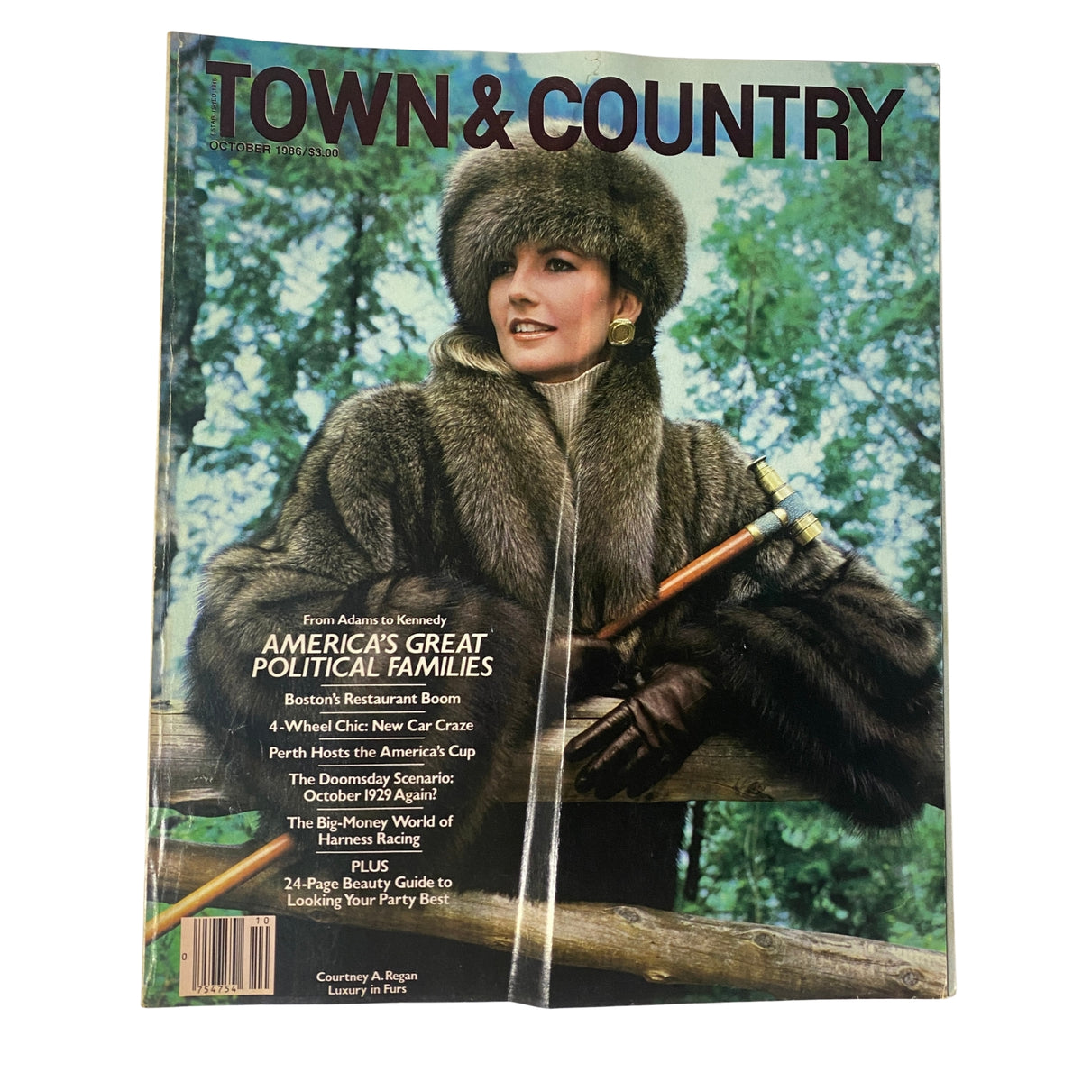 Town & Country Magazine October 1986 featuring Courtney Regan on the cover, showcasing autumn fashion in a luxurious fisher coat against a natural backdrop.