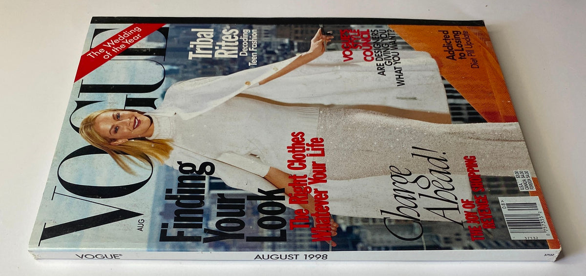 Vogue Magazine August 1998 cover displaying Carolyn Murphy showcasing a chic white ensemble, highlighting articles on style and fashion trends, including 'Finding Your Look' and 'Tribal Rites'.