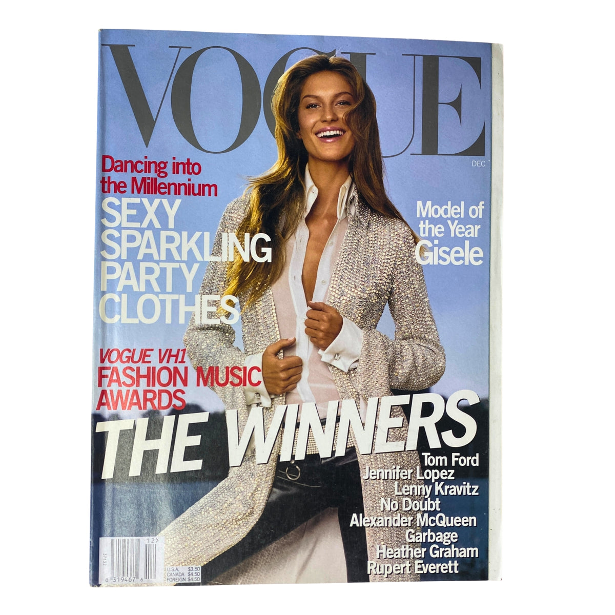 Vogue Magazine December 1999 cover featuring Gisele Bündchen, celebrating her title as Model of the Year. The cover displays vibrant text featuring 'Sexy Sparkling Party Clothes' and details on the Vogue/VH1 Fashion Music Awards.