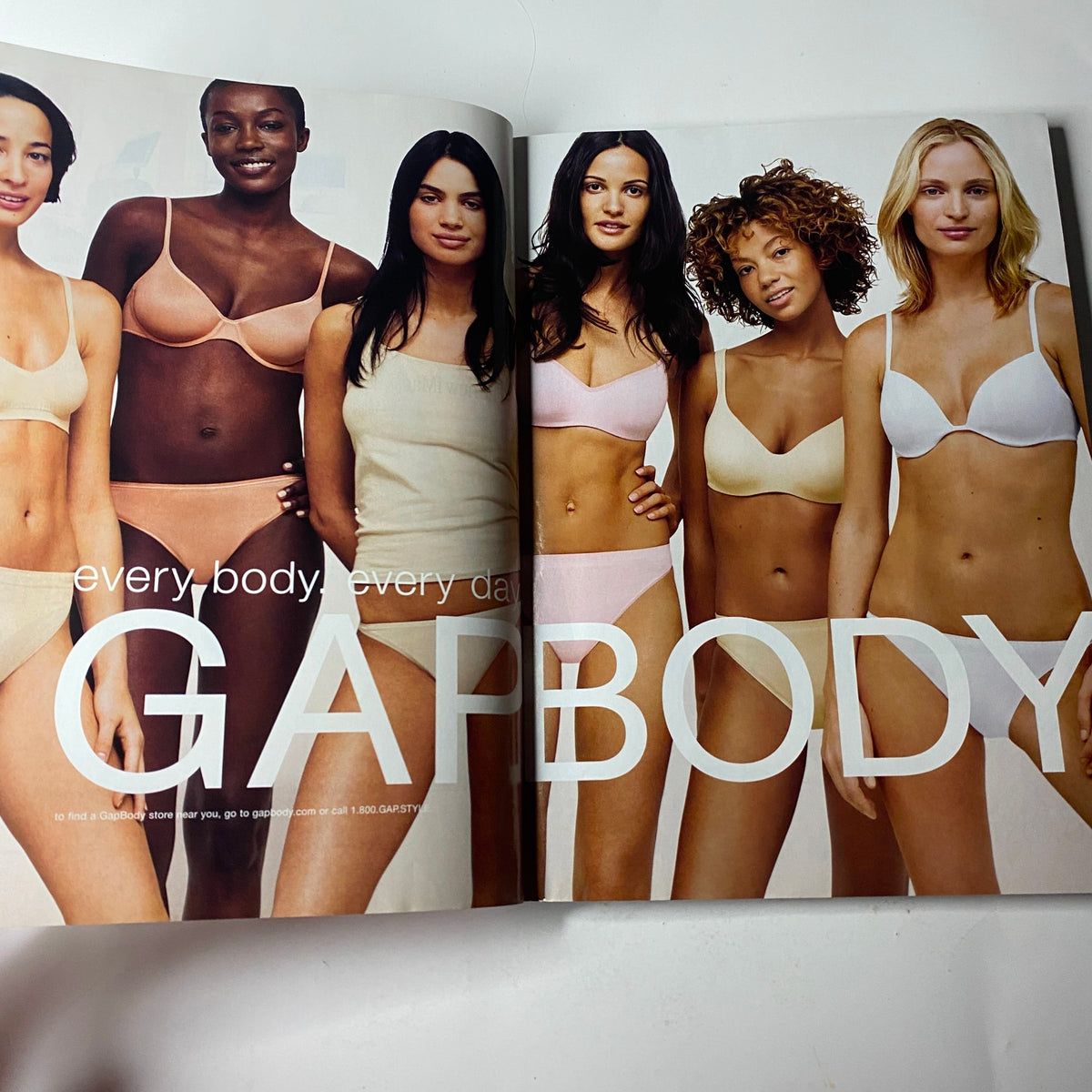 Double-page advertisement in Vogue Magazine May 2002 showcasing diverse models wearing GAP underwear, promoting body positivity.