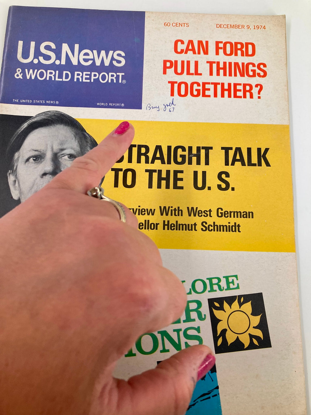 Close-up of the cover of US News & World Report Magazine December 9, 1974 showing an interview with Helmut Schmidt, highlighting a handwritten note and colorful vintage elements.