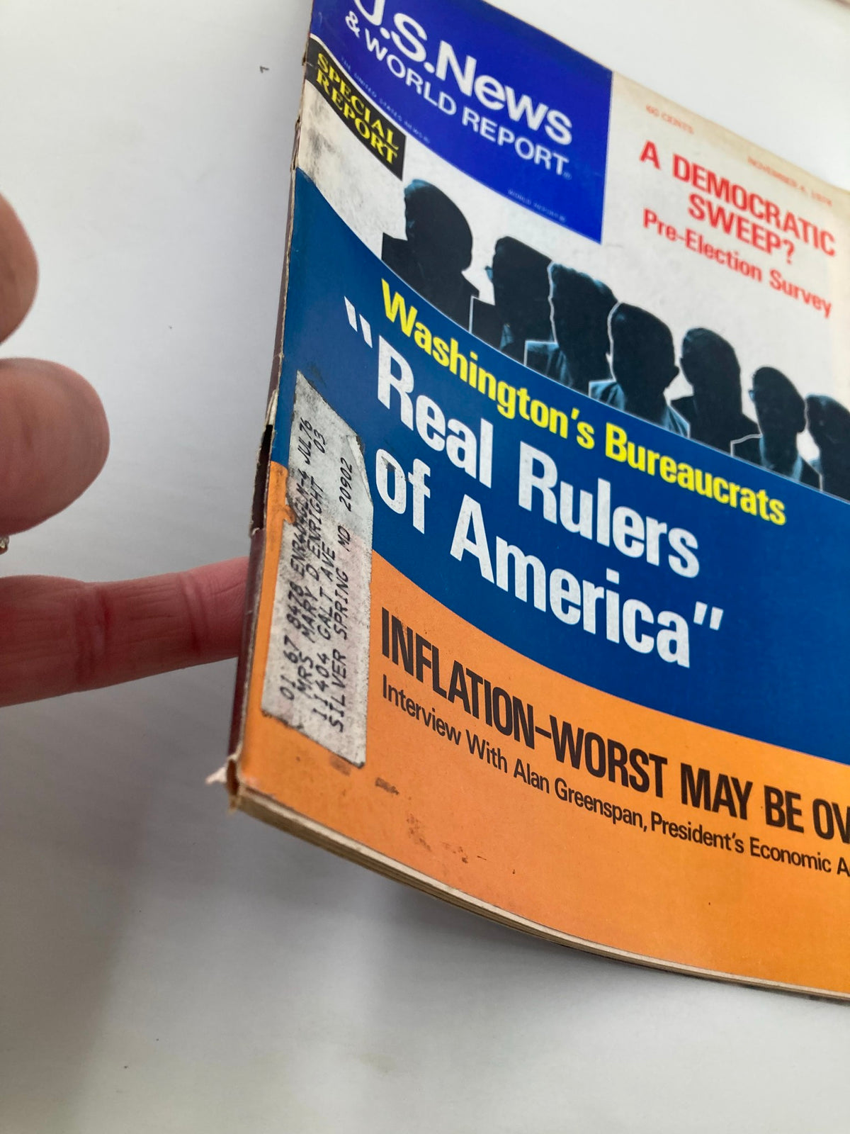 Close-up view of the cover of US News & World Report Magazine, November 4, 1974, showcasing the title "Inflation Worst May Be Over" and an interview with Alan Greenspan.