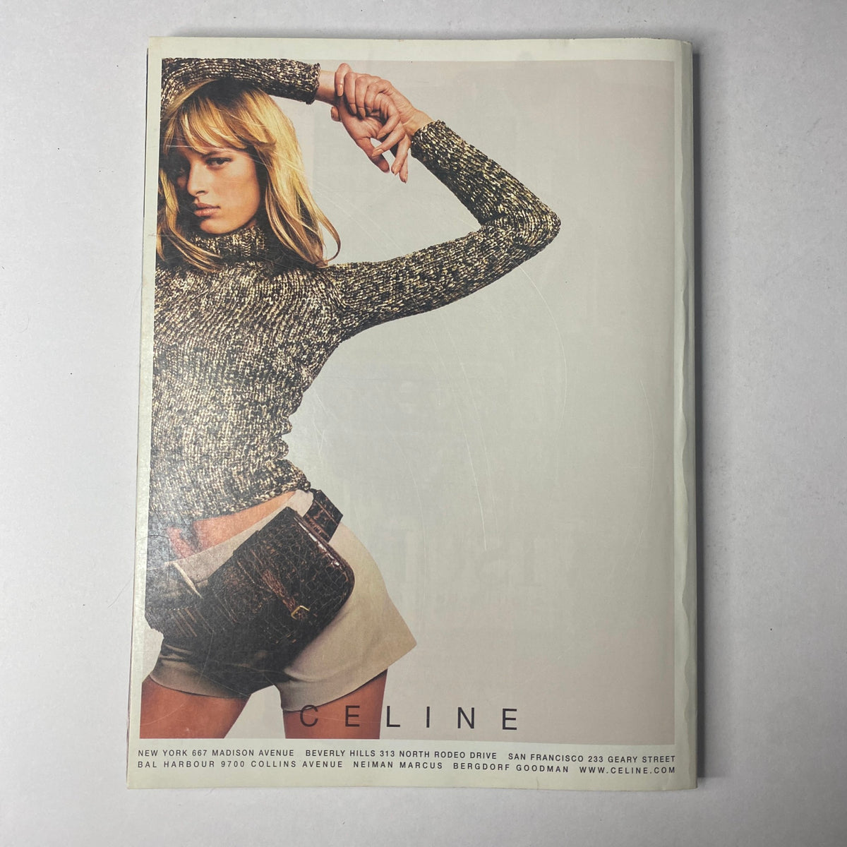 Vogue Magazine February 2001, depicting a Celine advertisement with a model in a stylish sweater and shorts, presenting Y2K fashion trends.
