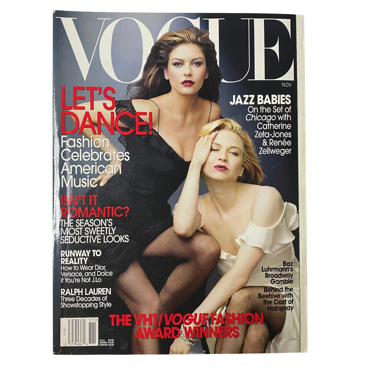 Vogue Magazine November 2002 featuring Catherine Zeta-Jones and Renée Zellweger on the cover. The image highlights the actresses in elegant attire celebrating American music, with bold text indicating 'Let's Dance!' and 'Jazz Babies' related to the film 'Chicago.' Perfect for collectors of vintage fashion magazines.