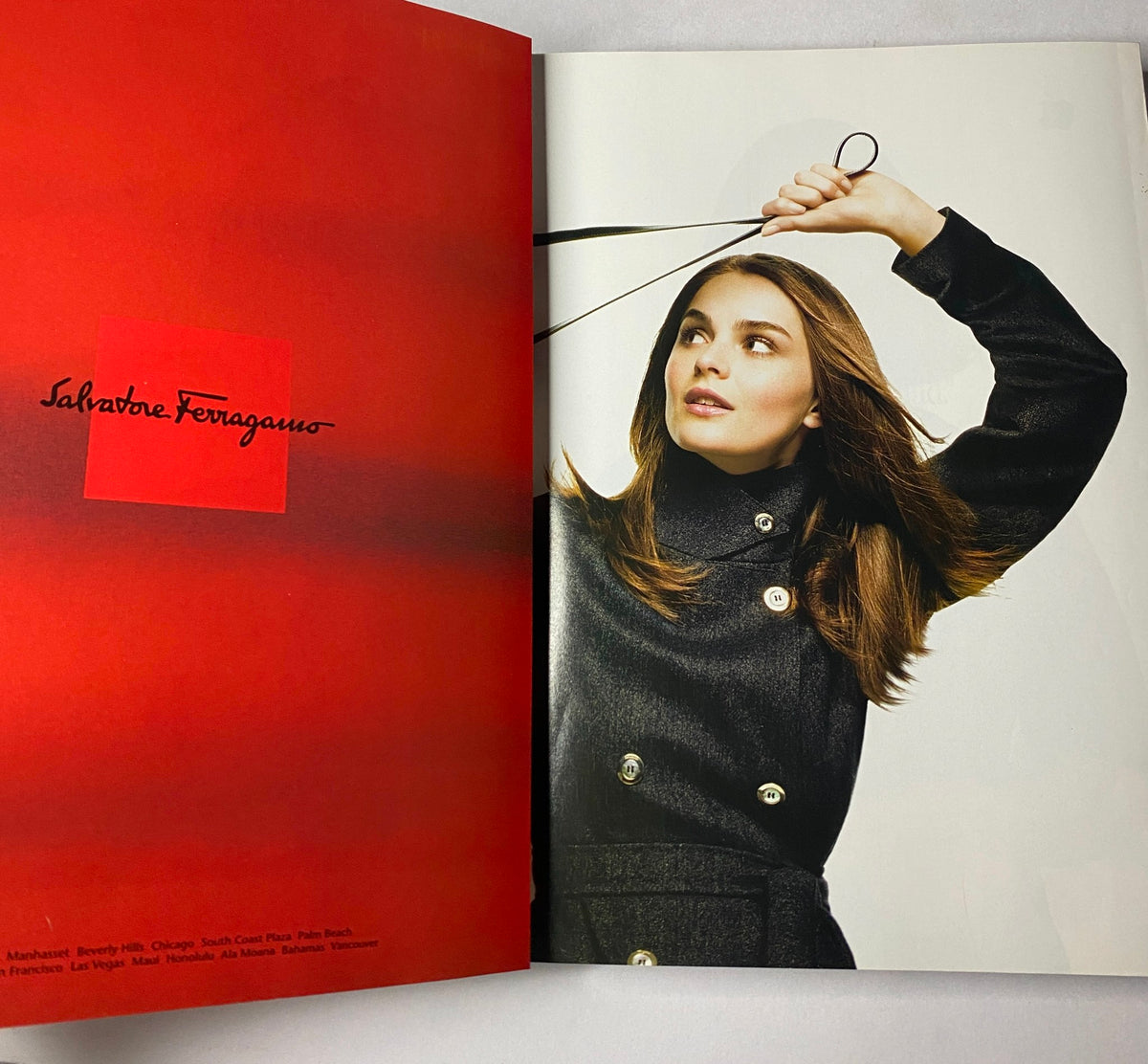 Salvatore Ferragamo advertisement from Vogue Magazine November 2002, showcasing a model with elegant styling.