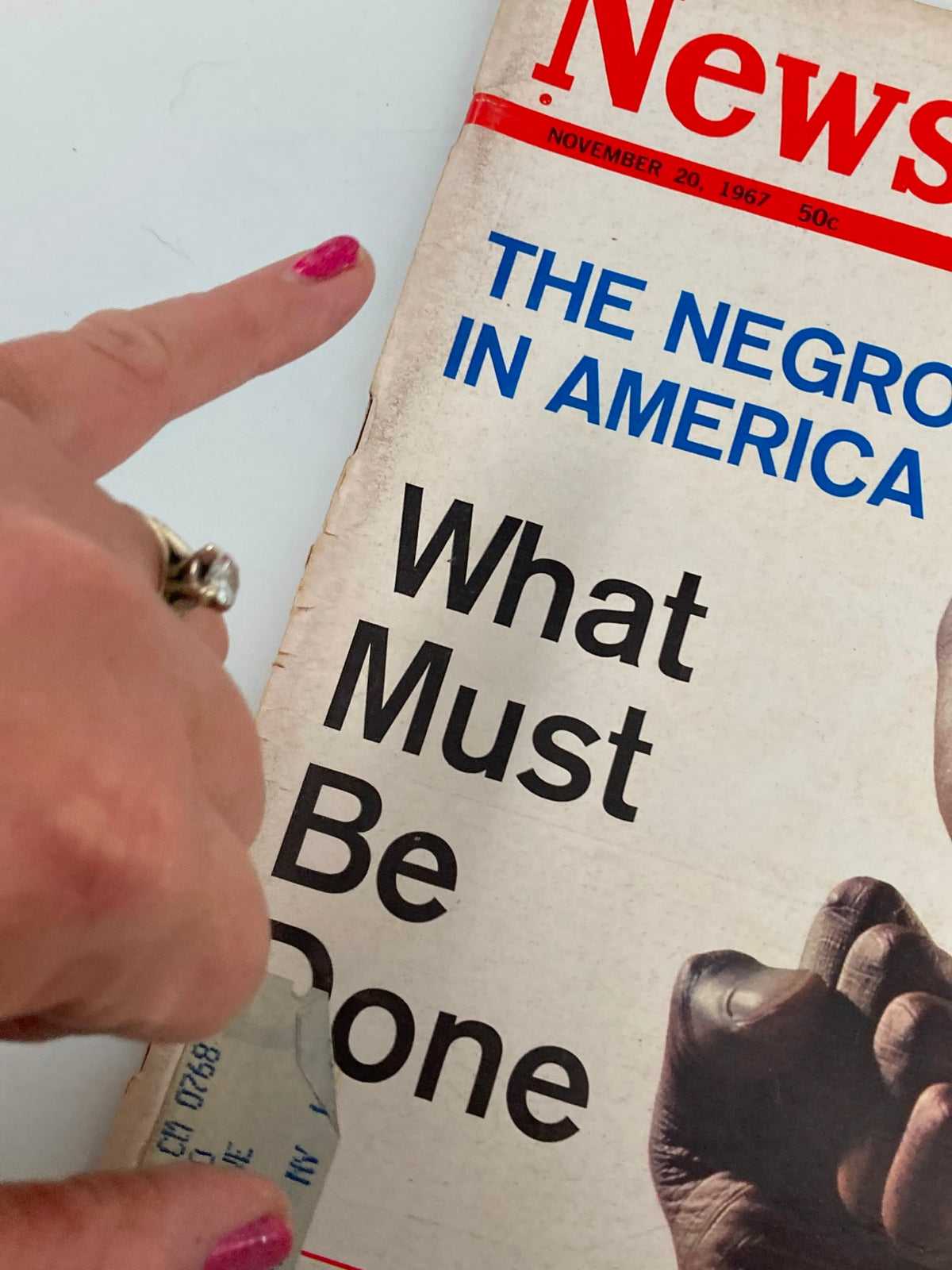 Close-up of the VTG Newsweek Magazine November 20, 1967 cover, showing the title 'The Negro in America: What Must Be Done' with a hand pointing at the title, indicating its significance in understanding civil rights issues of the era.