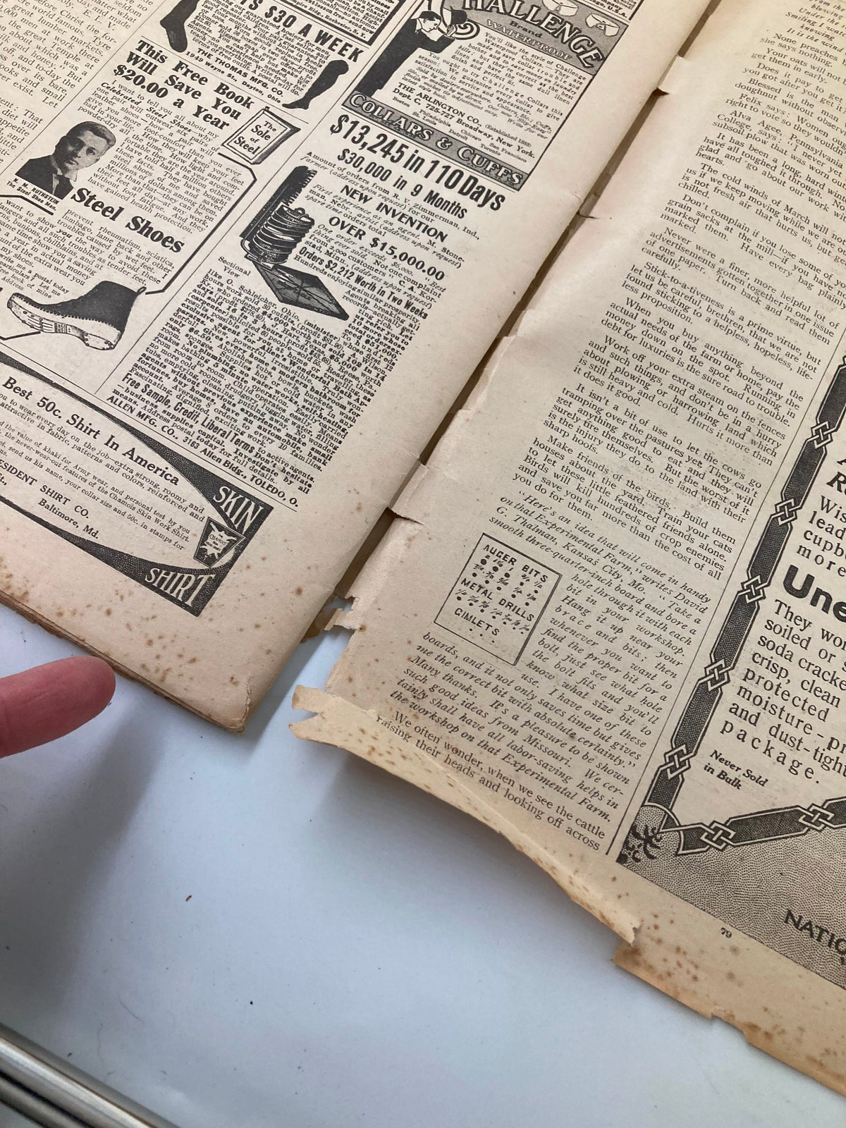 Close-up view of the interior pages of the VTG The Farm Journal Magazine March 1911, featuring historical advertisements and text, illustrating the magazine's condition and wear.