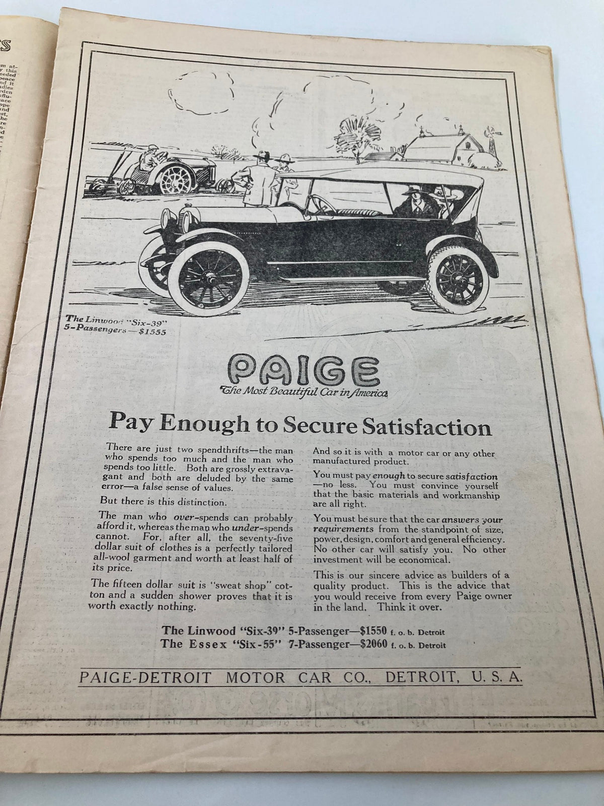 Interior advertisement from the VTG The National Stockman and Farmer magazine dated April 19, 1919, featuring a vintage car illustration and the slogan 'Pay Enough to Secure Satisfaction' for Paige-Detroit Motor Car Company.