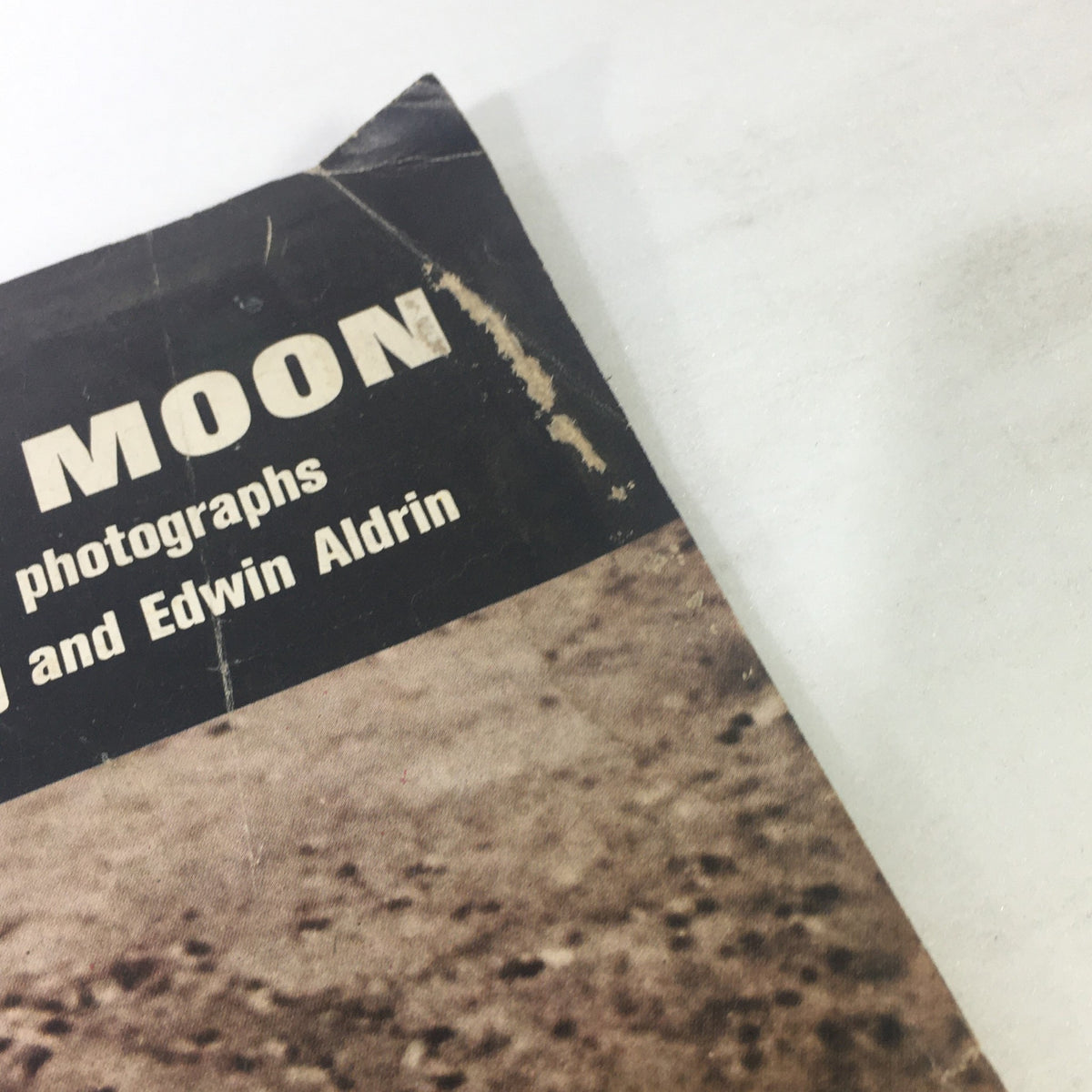 Detail shot of the side of VTG Life Magazine August 8 1969, showcasing the title 'MOON' along with wear on the magazine.