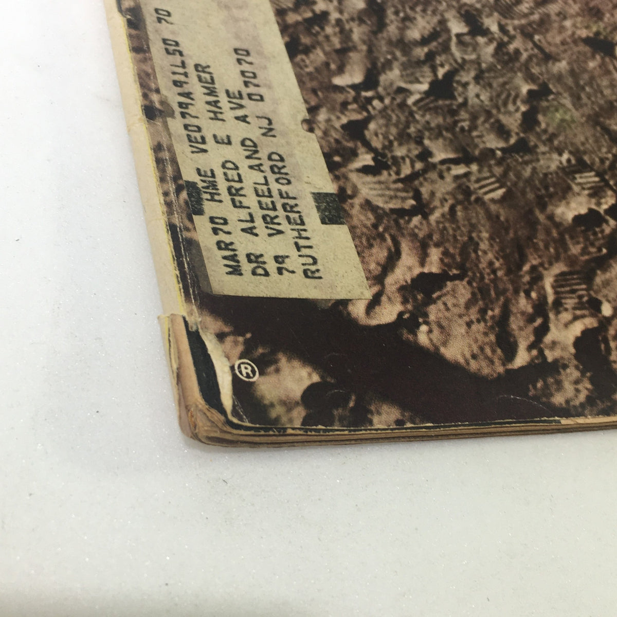 Detail of the vintage Life Magazine from August 8, 1969, showcasing a corner view with a label and slight wear, capturing the essence of the historic moon landing by Neil Armstrong and Edwin Aldrin.