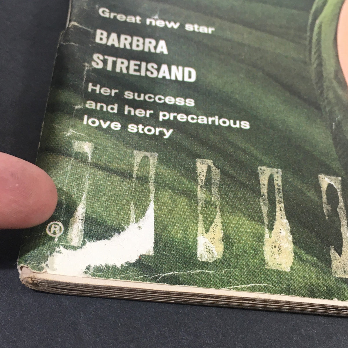 Side view of the VTG Life Magazine cover, revealing details about Barbra Streisand's success and the vintage condition of the magazine.