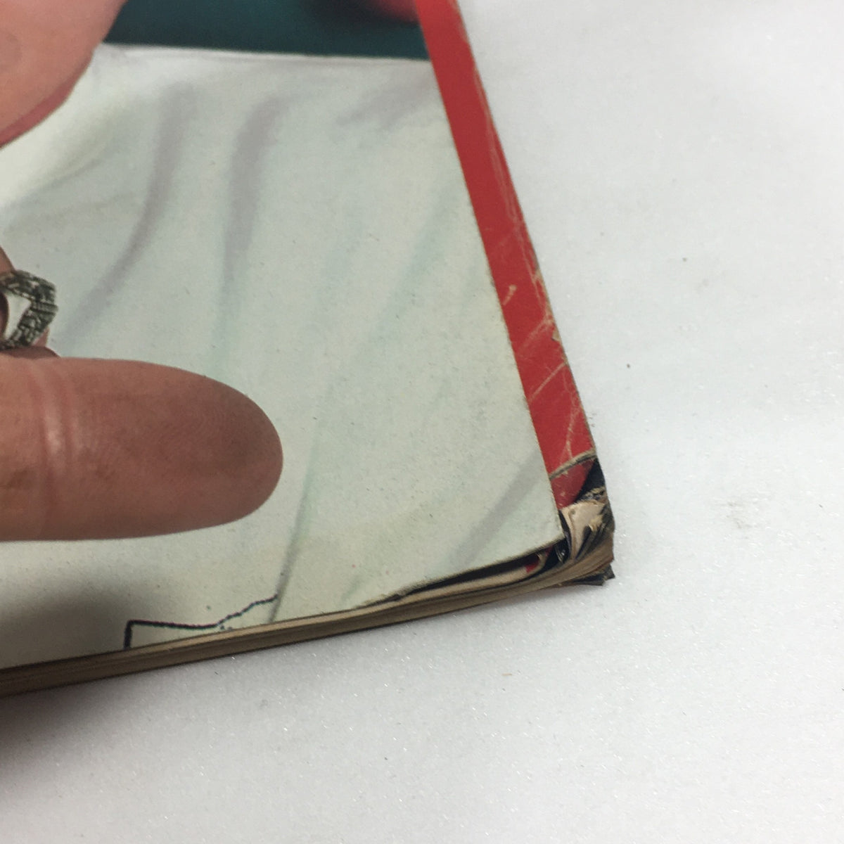 Close-up of the damaged edge of Vintage Life Magazine - November 1986, showcasing wear typical for its age.