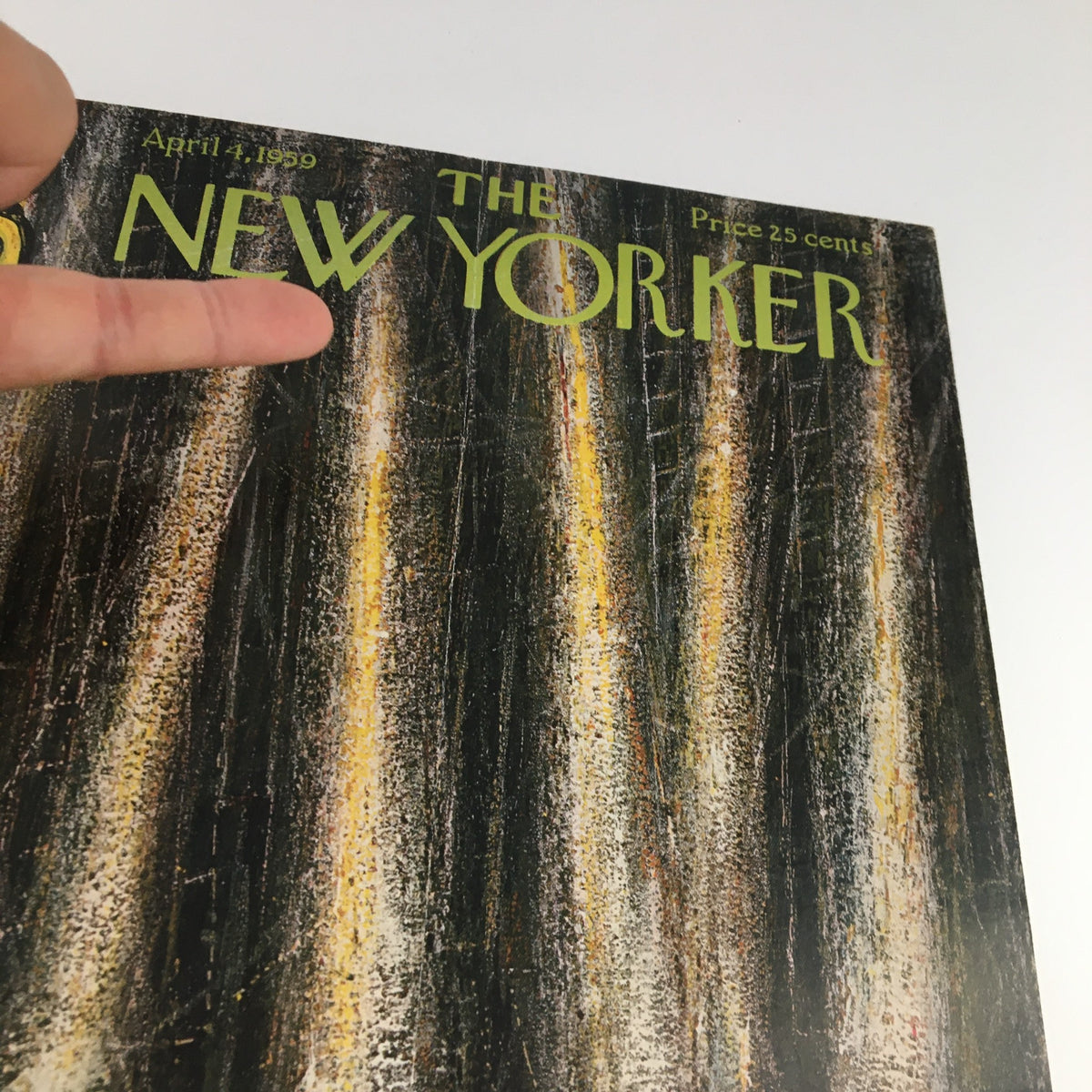 Close-up view of The New Yorker April 4, 1959 cover showcasing the magazine title designed by Abe Birnbaum, highlighting detailed artistic elements.