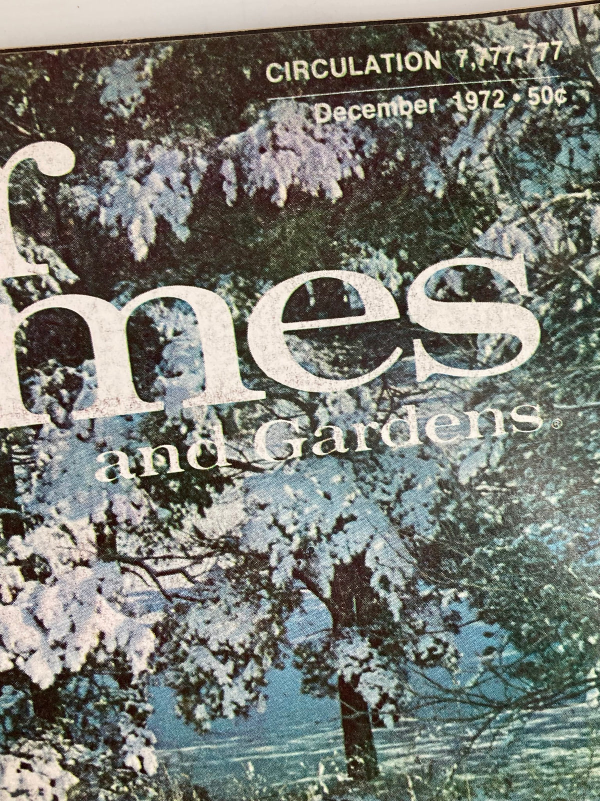 Close-up of the title on the cover of VTG Better Homes and Gardens Magazine December 1972 showcasing the magazine's vintage design with snow-covered trees in the background