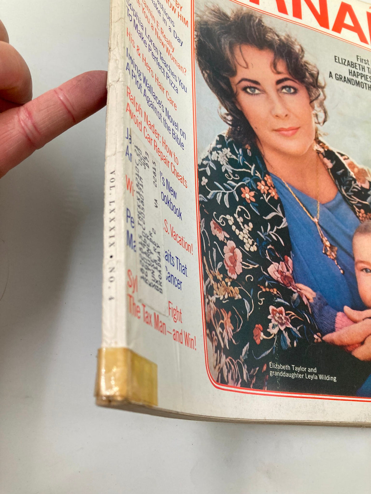 Detail of the spine of the VTG Ladies' Home Journal Magazine April 1972 featuring Elizabeth Taylor and her granddaughter. The magazine is in good condition showing slight wear and includes articles reflective of 1970s lifestyle.