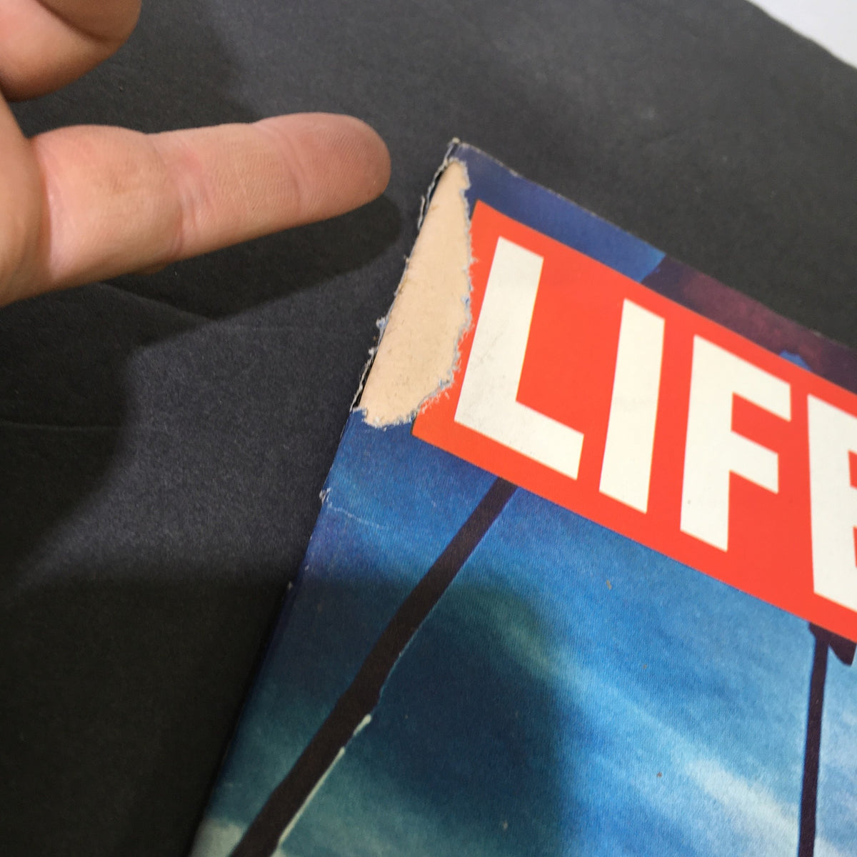 Close-up of the cover of the vintage Life Magazine from March 6, 1970, highlighting a damaged corner, features Billy Kidd, America's first Olympic ski gold medal winner, making it a unique collectible.