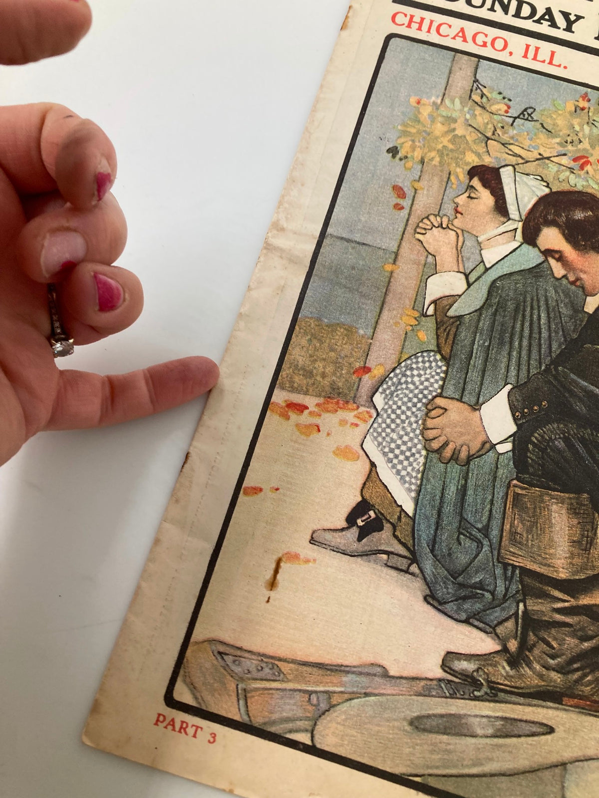Close-up view of the edge of the Vintage The Sunday Magazine, November 25 1906, showing the wear and tear of this collectible item.