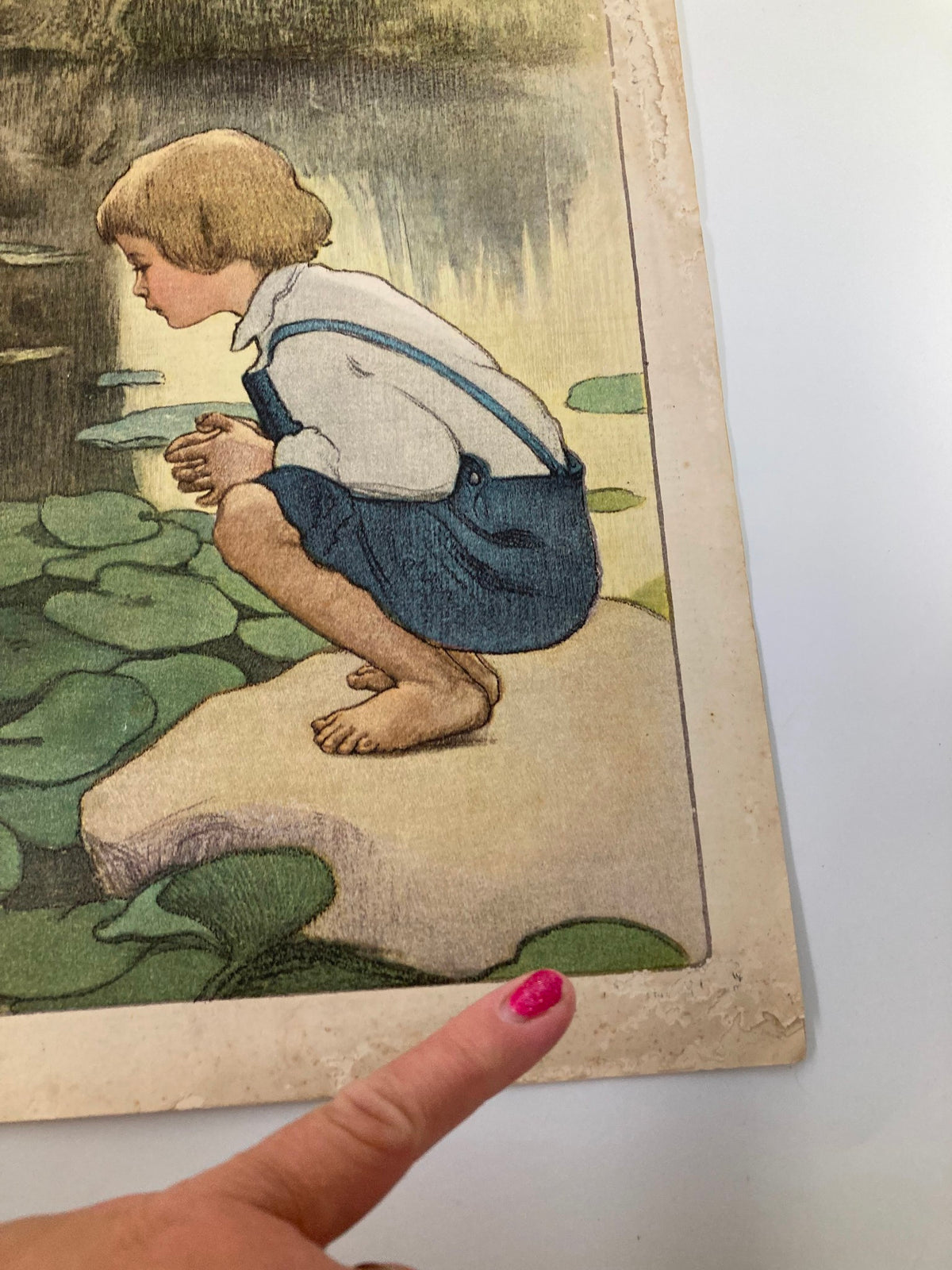 Close-up of the cover of VTG The Sunday Magazine June 21 1908, showing the boy's seated position on a lily pad with marked wear.