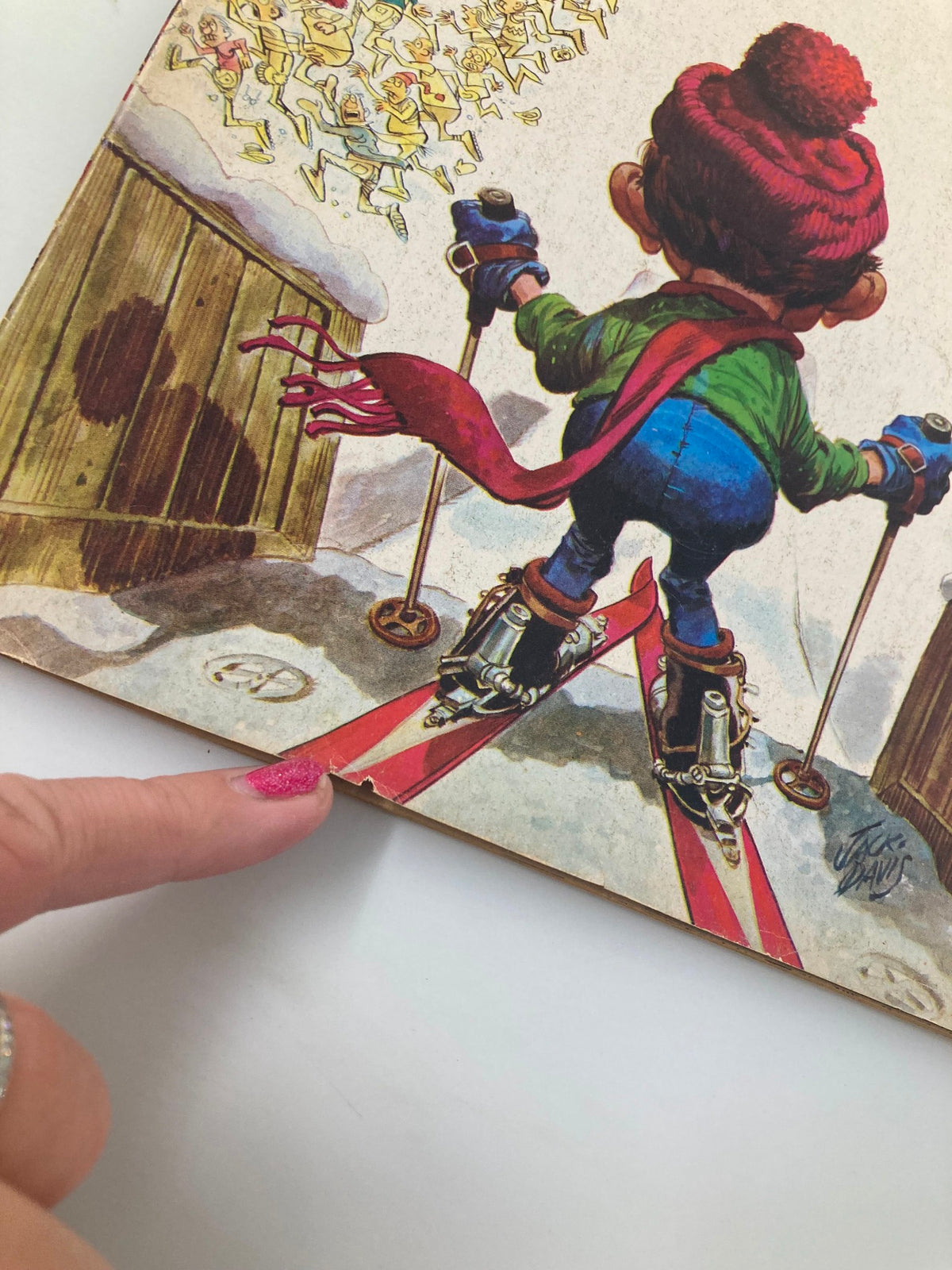 Cover illustration of Mad Magazine March 1975 No. 173 featuring Alfred E. Neuman skiing, with a humorous scene of cartoon characters in the background. The image captures the comedic essence of the issue titled 'Alfred Goes Skiing', showcasing the playful art style characteristic of vintage magazines.