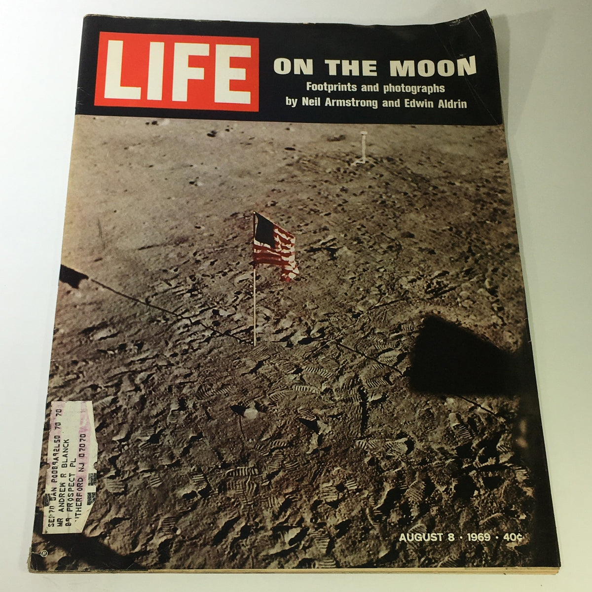 Life Magazine August 8 1969 cover featuring the iconic moon landing photograph with flag set by Neil Armstrong and Edwin Aldrin.