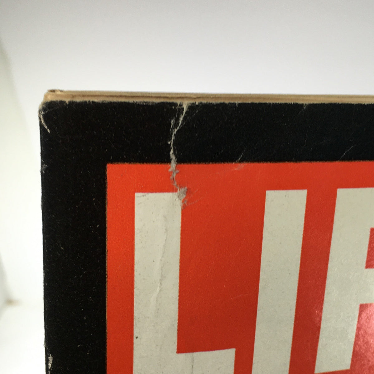 Close-up view of the top corner of the Vintage Life Magazine dated December 12, 1969, showing creases and wear on the title 'LIFE'.