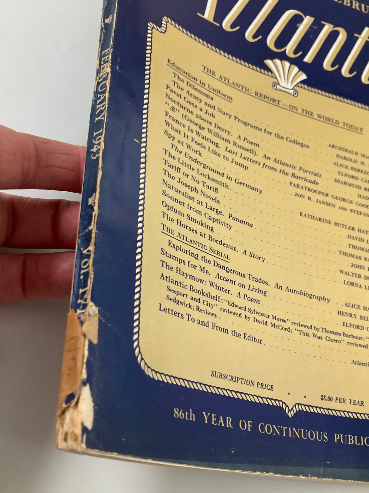 Side view of VTG The Atlantic Magazine February 1943 showing spine wear and details of the publication year.