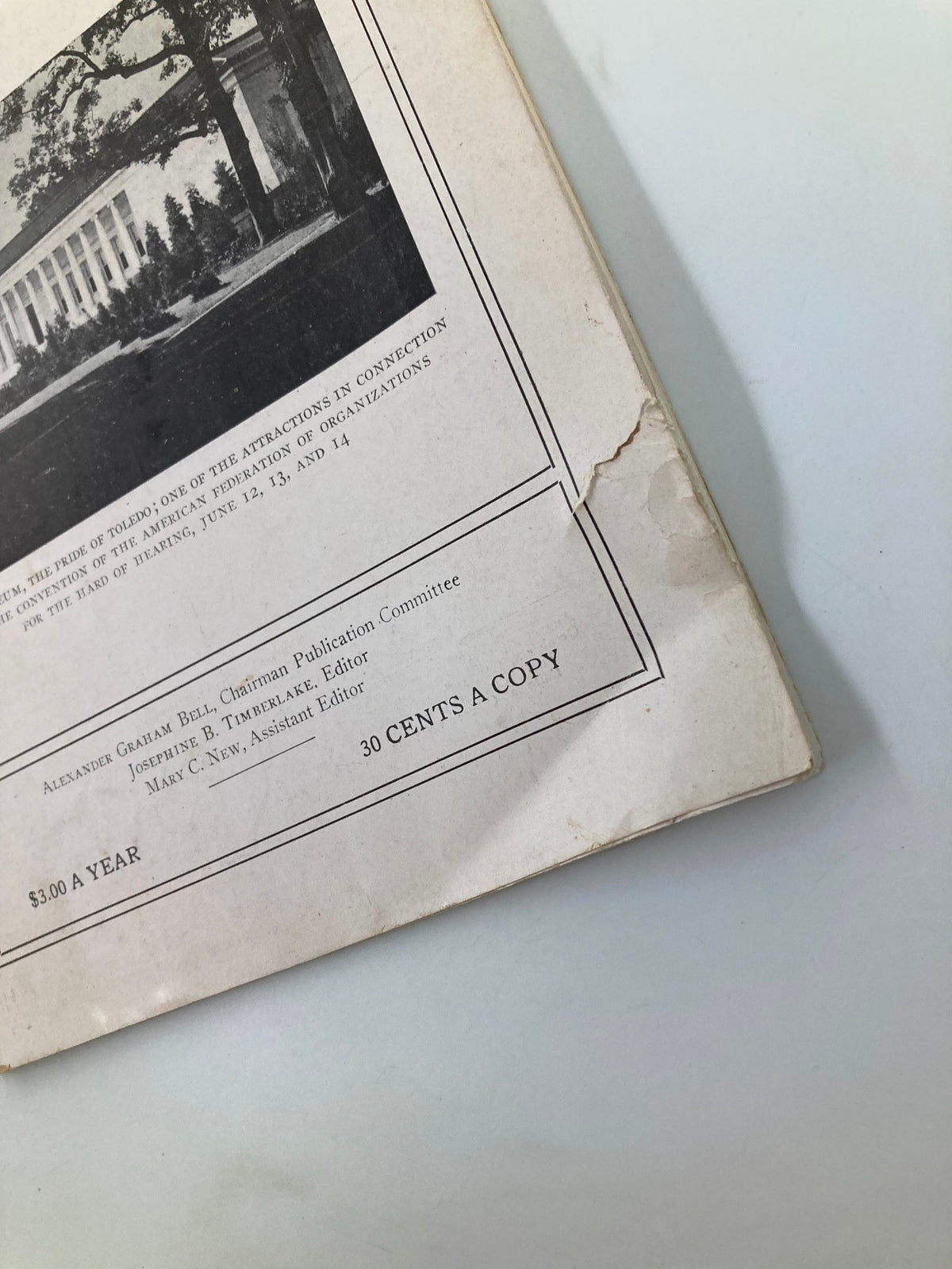 Detail of the corner of the vintage VTG Volta Review Magazine June 1922, showing publication information and a minor tear.