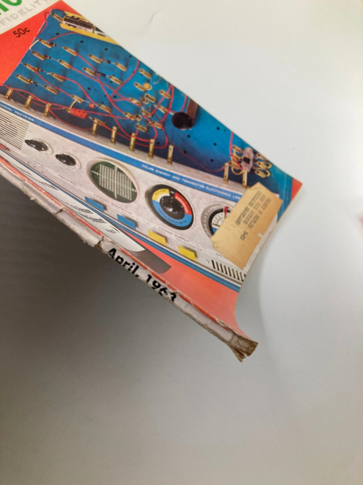 Side view of the VTG Radio-Electronics Magazine April 1963 showcasing the spine and wear, indicative of its vintage status and history in electronics.