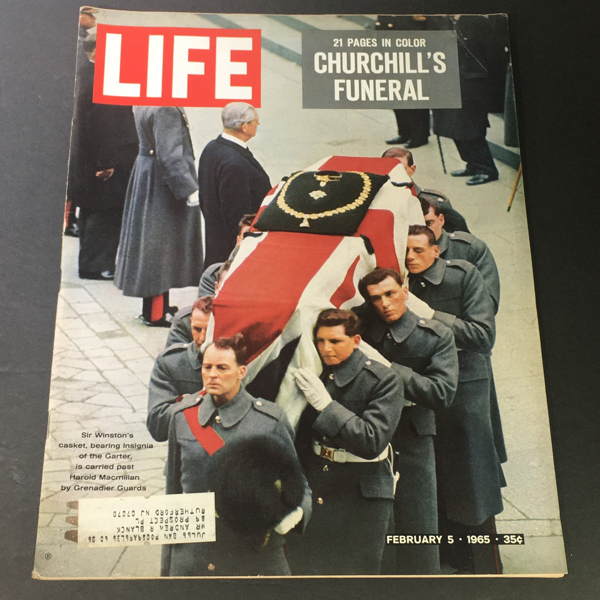 Cover of Life Magazine dated February 5, 1965, featuring a historical image of Winston Churchill's funeral with a casket draped in the Union Jack, surrounded by solemn military personnel, highlighting the tribute to the iconic British Prime Minister.