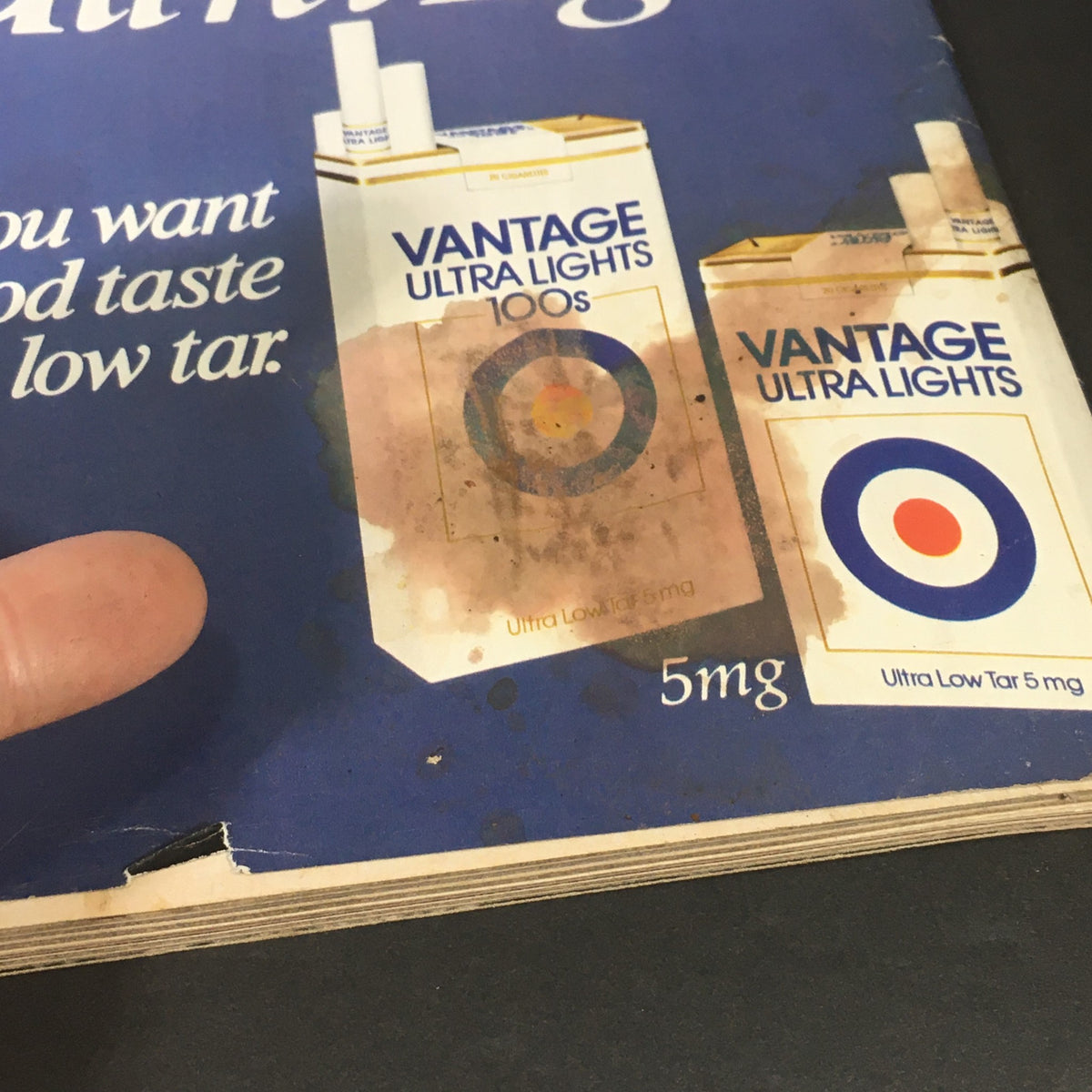 Close-up of a damaged page from the January 1983 Life Magazine featuring Vantage Ultra Lights cigarette advertisement.