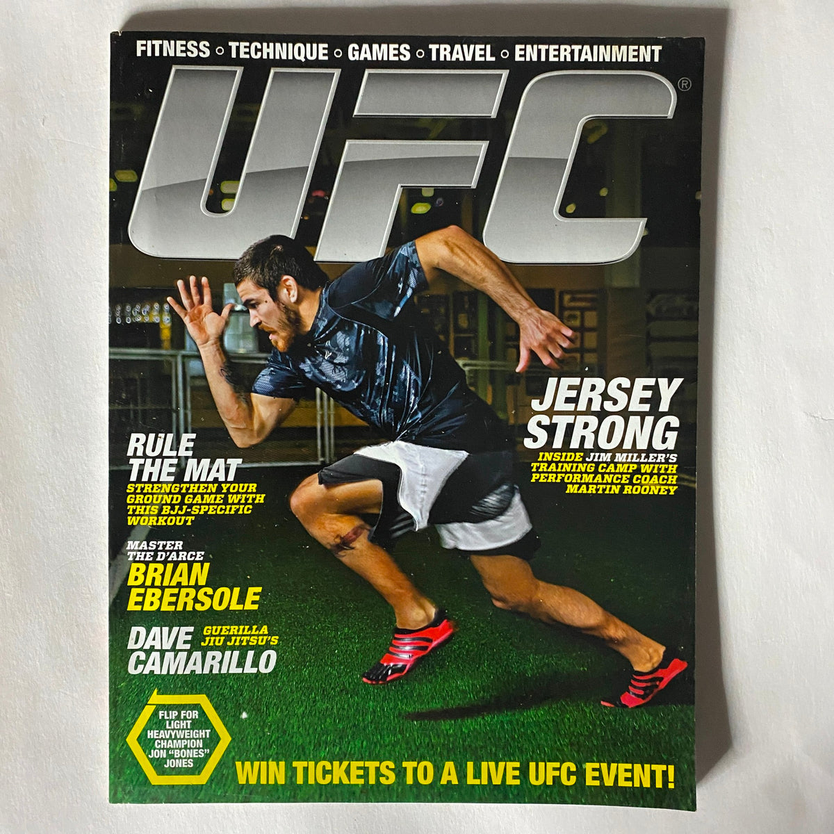 UFC Magazine with a focus on fitness and technique, highlighting the importance of athleticism and training, featuring an athlete in motion on the cover. A valuable addition to any mixed martial arts collection.