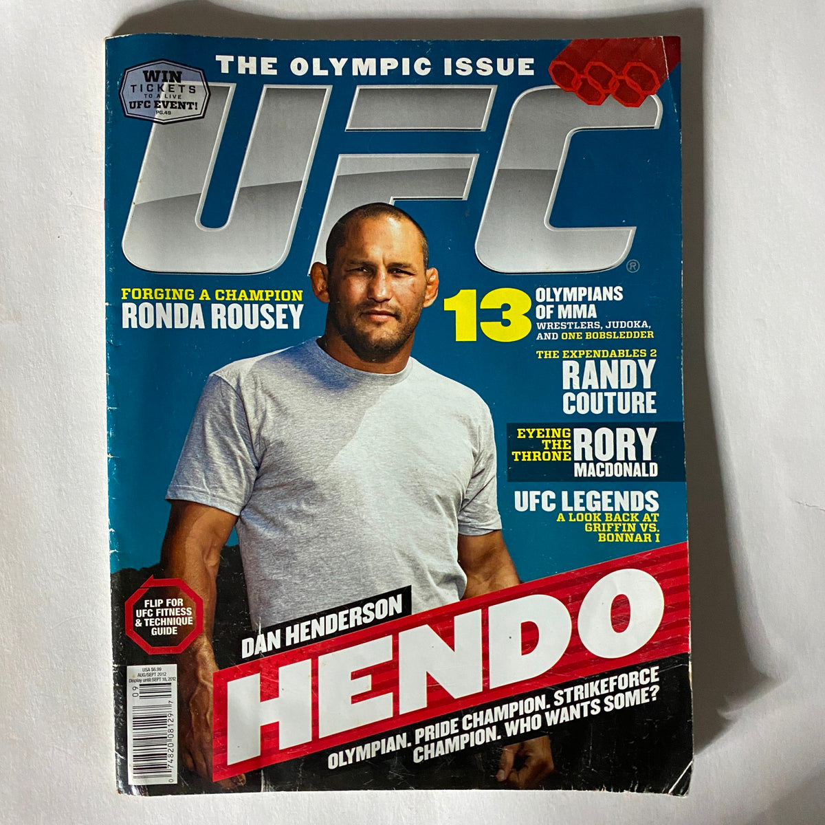 UFC Magazine showcasing Ronda Rousey, the Olympic bronze medalist and mixed martial arts champion, as part of the Olympic issue.