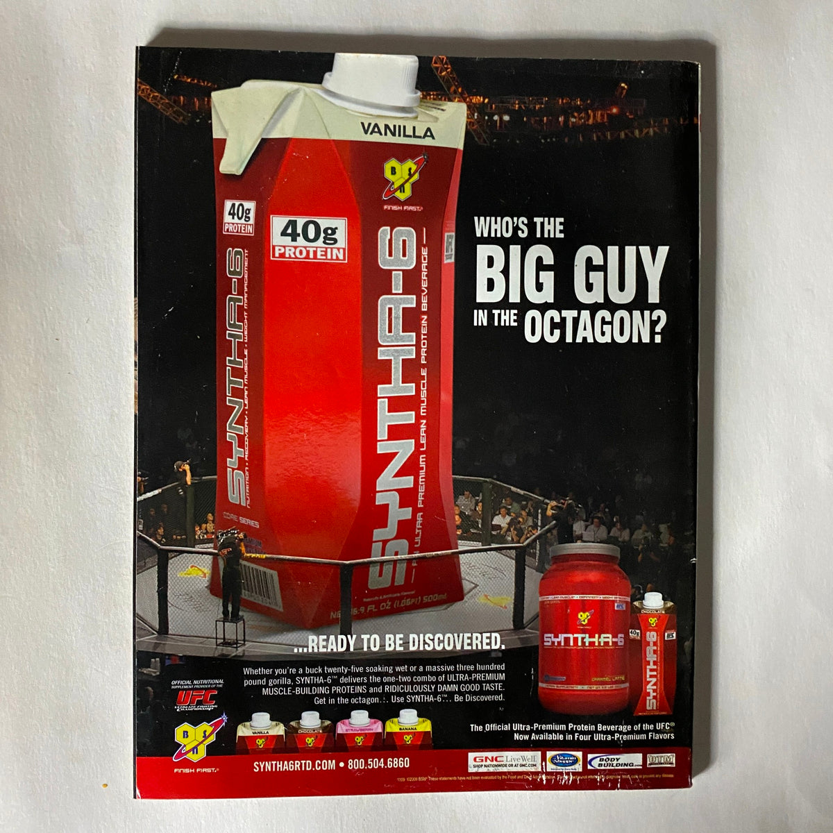 Back cover of UFC Magazine December / January 2010 No. 2 featuring an advertisement for SYNTHA-6 protein with the tagline 'Who's the BIG GUY in the Octagon?' and a visual of the protein product.
