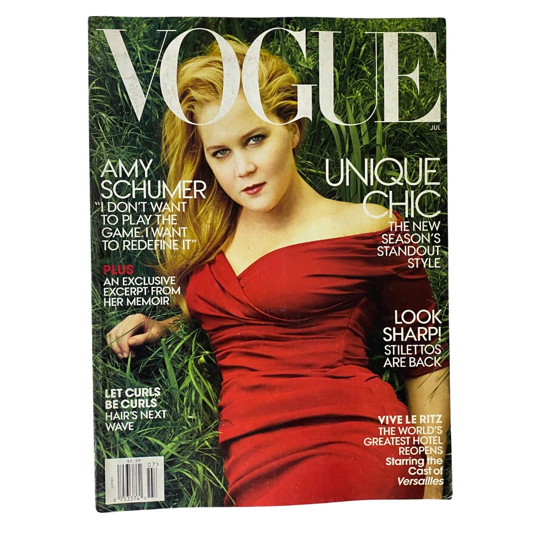 Vogue US Magazine July 2016 cover featuring actress Amy Schumer in a red dress, showcasing high fashion and celebrity culture.