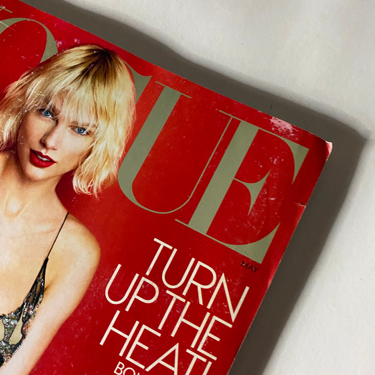 Close-up of the May 2016 Vogue US Magazine cover featuring Taylor Swift, highlighting the tagline 'Turn Up the Heat'.