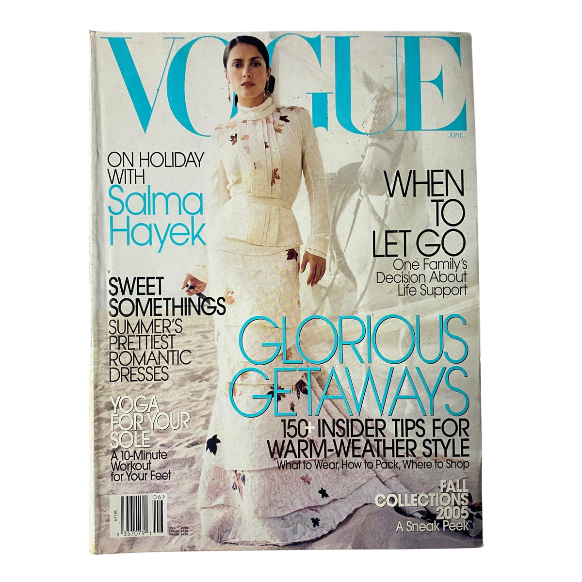 Cover of Vogue Magazine June 2005 featuring actress Salma Hayek in a stunning white outfit with floral details, showcasing the title, 'Vogue June 2005 Salma Hayek Cover No Label'.