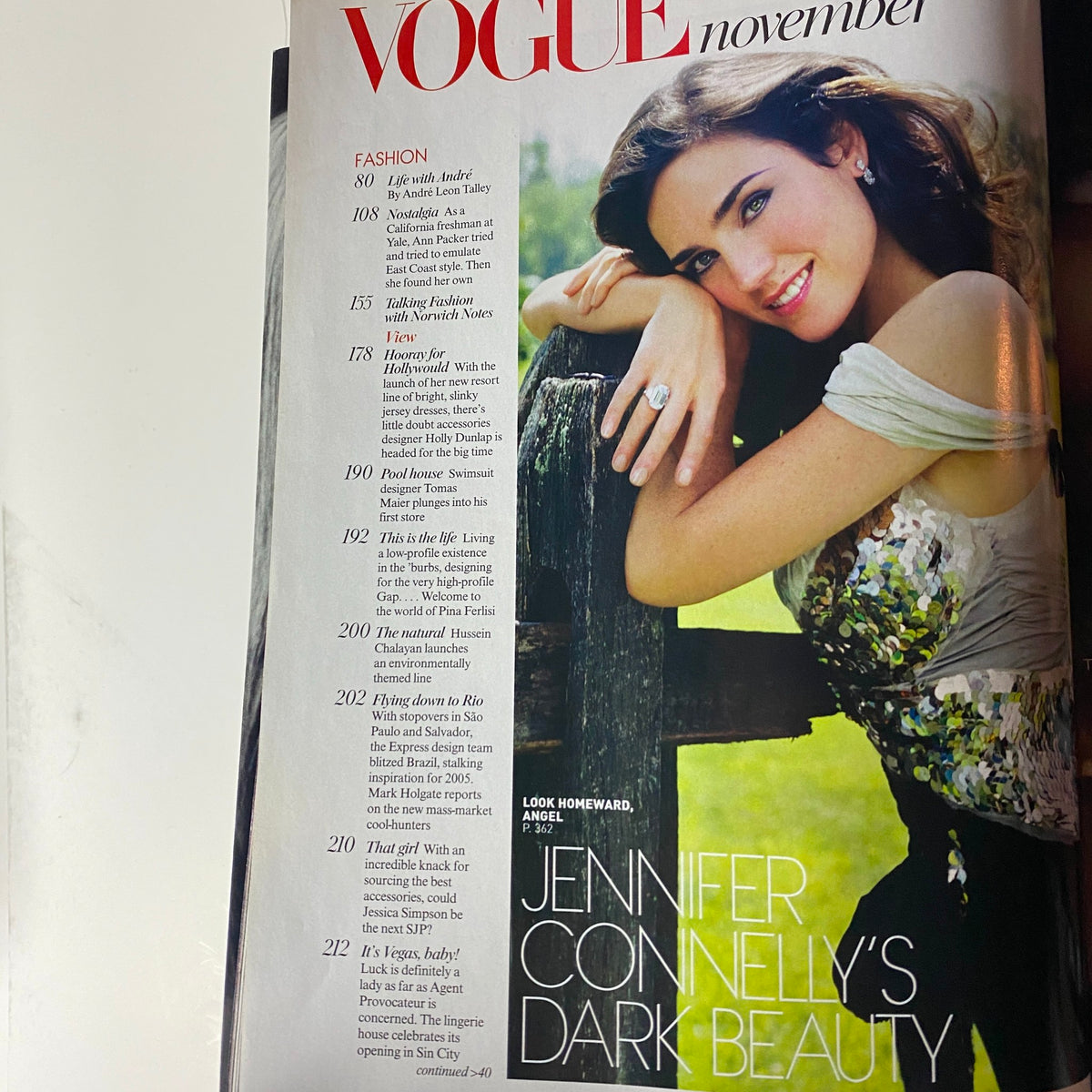 Interior page from Vogue Magazine November 2004 highlighting articles about fashion and Jennifer Connelly's dark beauty.