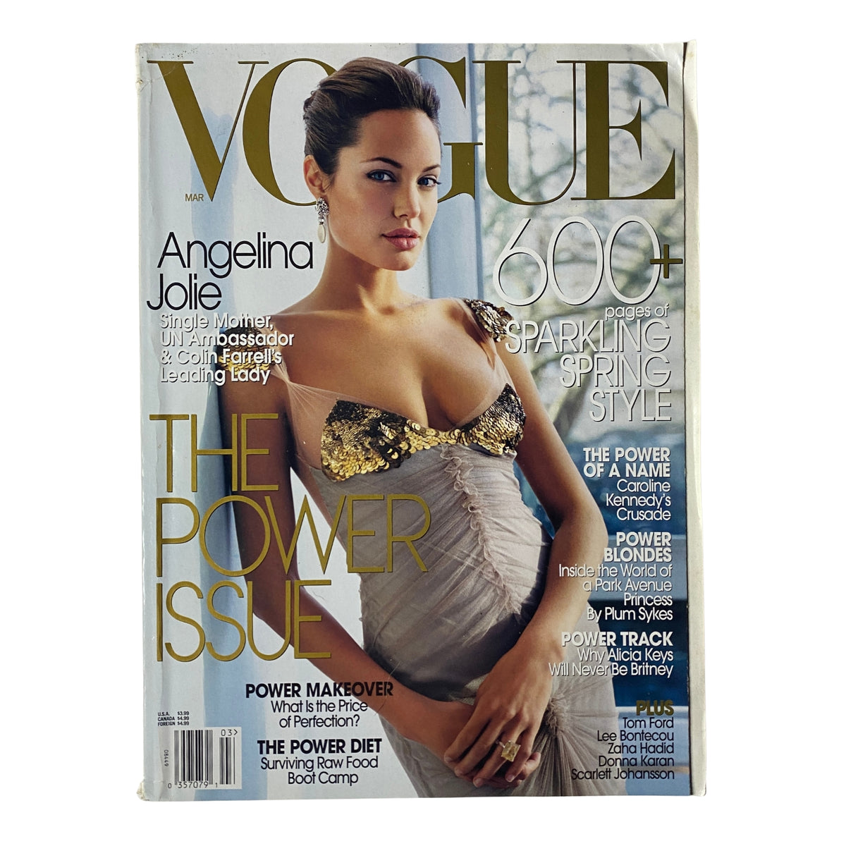 Vogue Magazine March 2004 cover featuring Angelina Jolie; the cover highlights her role as a Hollywood icon and humanitarian with the title 'The Power Issue'.