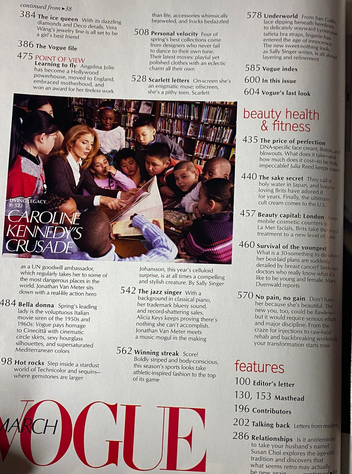 Vogue Magazine March 2004 featuring Angelina Jolie in a powerful cover story, alongside children, highlighting her role as a UN goodwill ambassador.