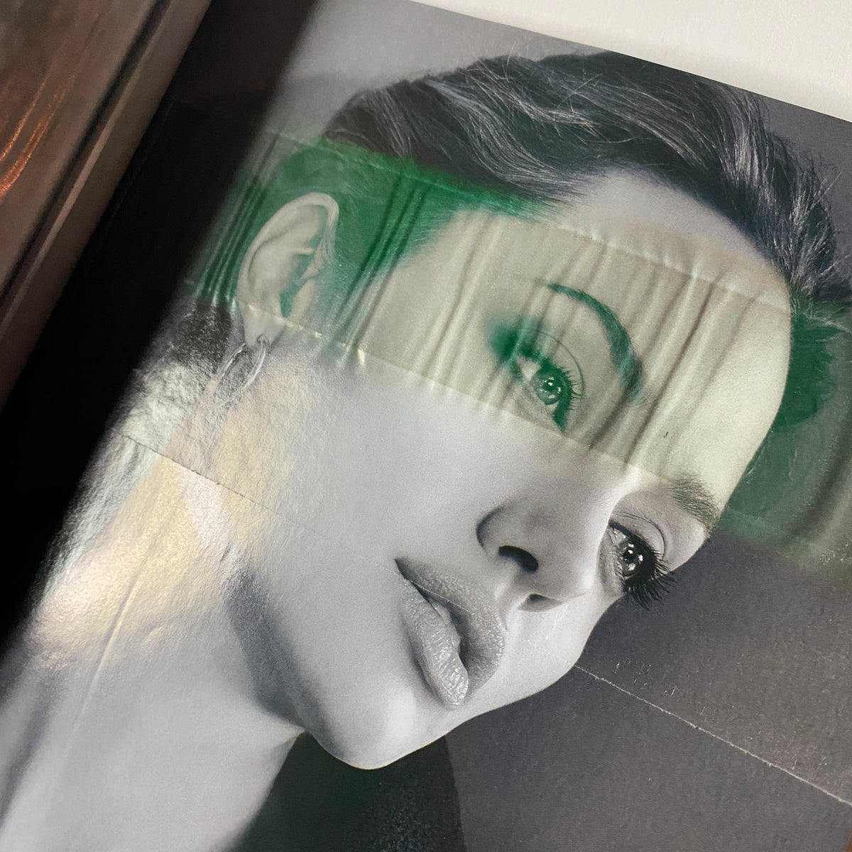 Vogue Magazine February 2006 Drew Barrymore Cover - A close-up portrait of a striking model, captured in black and white, highlighting beauty and sophistication in fashion photography.