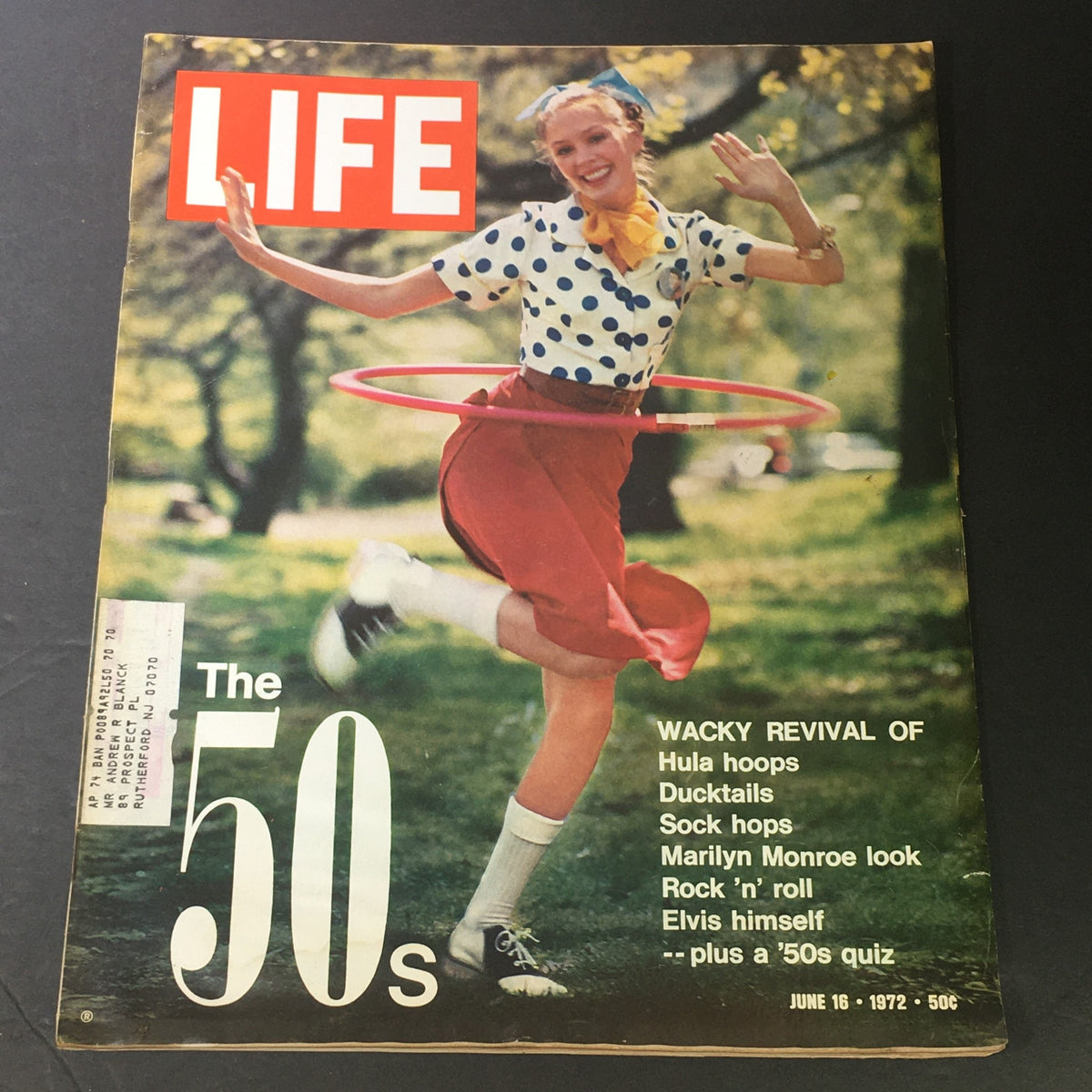 Cover of Life Magazine from June 16, 1972, featuring the title 'VTG Life Magazine June 16 1972 - 50's Wacky Revival of Elvis Presley & Hula Hoop'. The image showcases a woman in a polka-dotted shirt and red skirt hula hooping in a park, capturing the playful spirit of the 1950s.