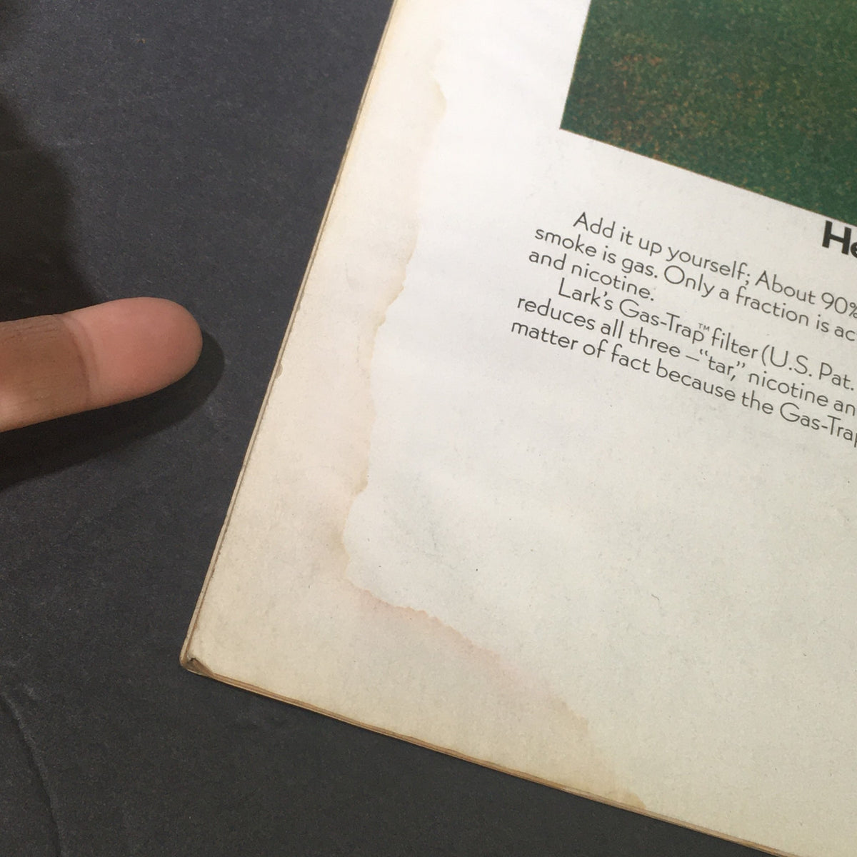 Interior page of VTG Life Magazine June 27 1969 featuring an advertisement with a finger pointing to text about Lark's Gas-Trap filter, highlighting product information and some water damage.