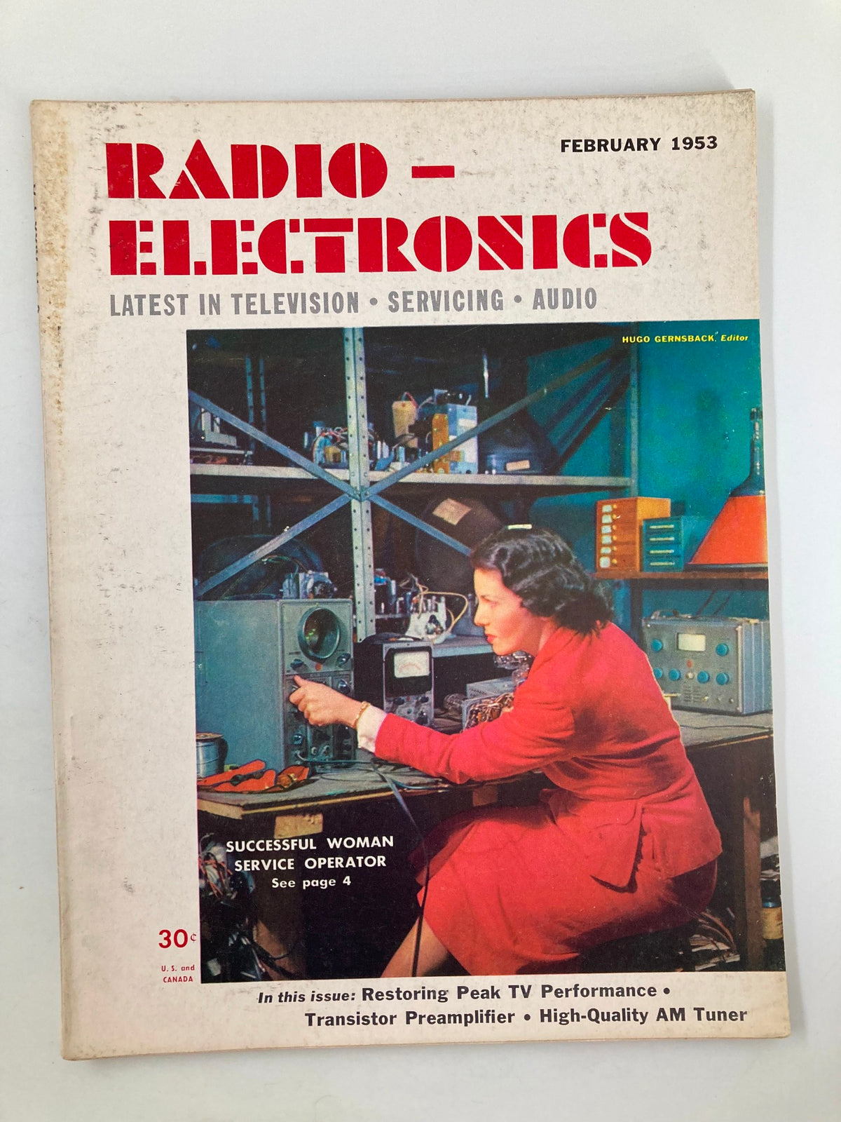Cover of VTG Radio-Electronics Magazine February 1953 featuring the article 'Successful Woman Service Operator', highlighting a woman working on radio equipment, showcasing vintage technology and design.