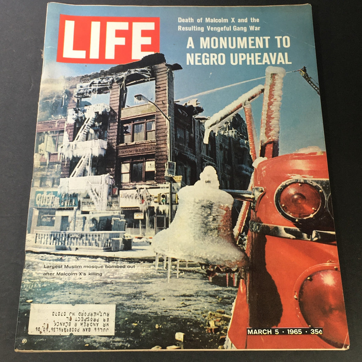 Cover of VTG Life Magazine March 5 1965 titled 'Death of Malcolm X and the Resulting Vengeful Gang War' featuring the bombing aftermath of a Muslim mosque, illustrating a monumental moment of Negro upheaval in American history.